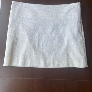 Theory white textured mini skirt size 10 good condition, spot on bottom right